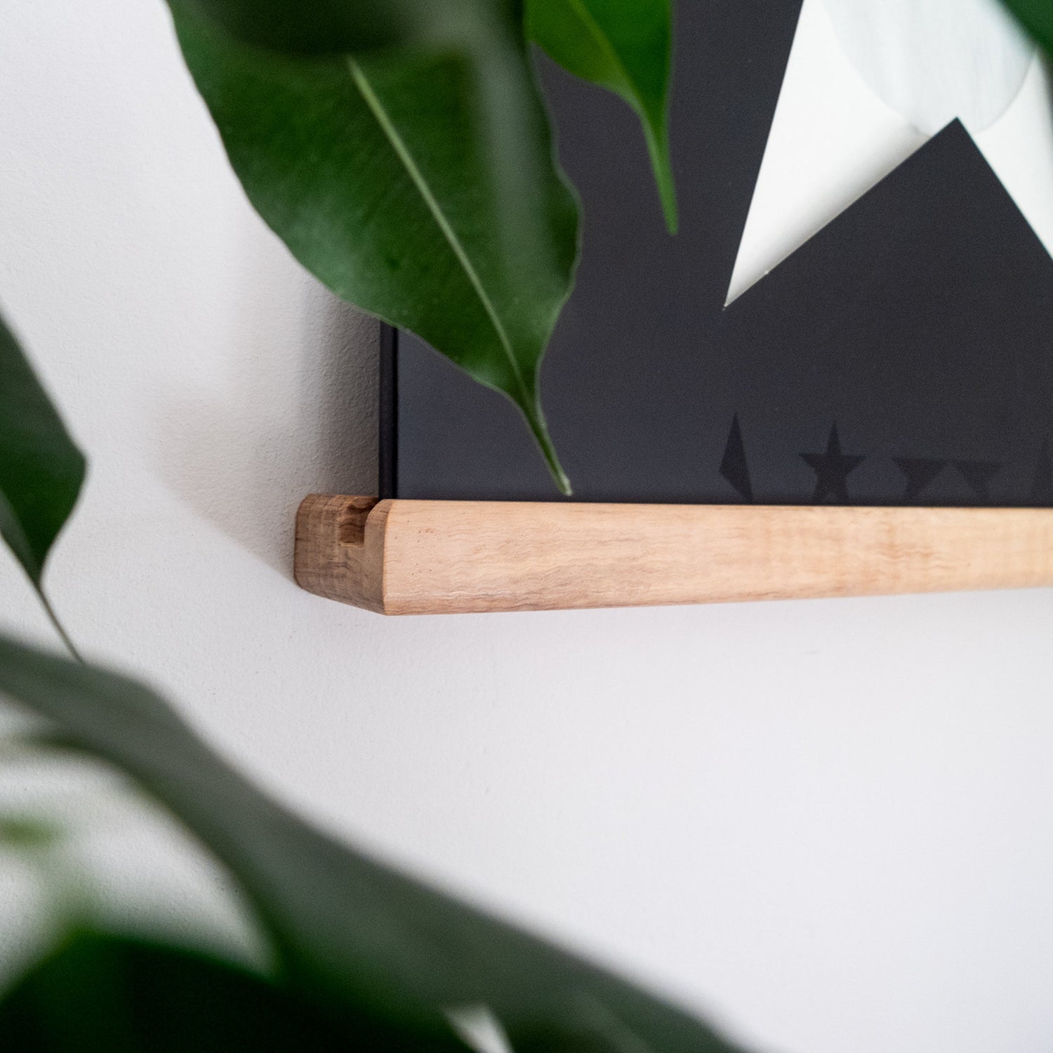 An ash record ledge against an off-white wall