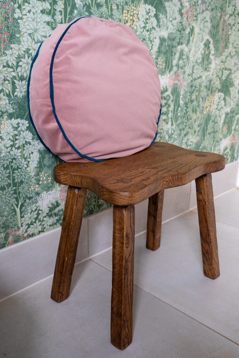 Close up detailing the cuboid leg shape of the stool and the smooth end grain.
